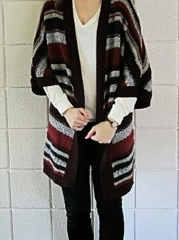 """
Here's a hot chick, wearing some fuckin' sweater, standing all sultry like, with her tits hangin' out the neckhole.
"""