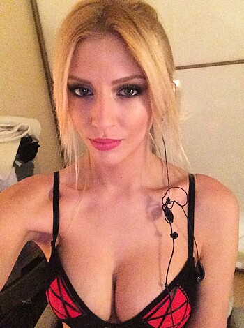 "A hot-ass chick in a bra is standin' there."