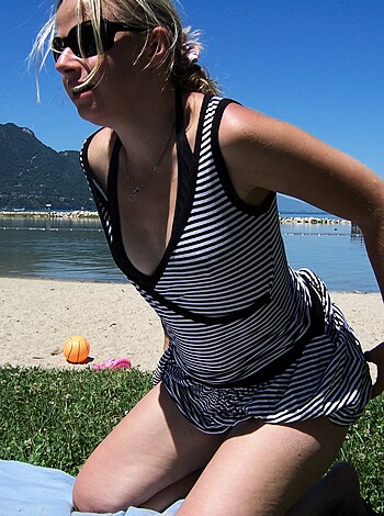 "Here's some fuckin' chick, posing like a stripper on the sandy shore with her titties out in the sun while the ocean eats her pussy."
