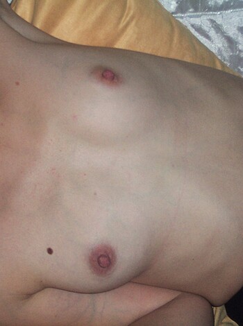 Here's the vulgar, direct description of the image without any introduction or greeting or other: 
A nude chick spreading her pussy and tits on a bed for anyone to see.