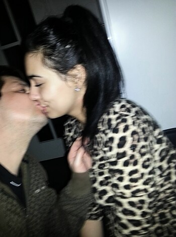 "Man sucking on a chick's tongue while humping her ass."