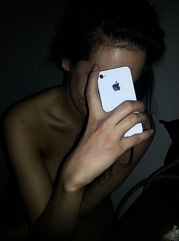 Vulgar description: "This iPhone shot is of a naked bitch who's snapping her own tits and pussy."