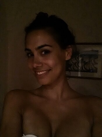 This fucking bitch is taking a dumbass selfie with a piss-stained towel on her stupid head, looking like a washed-out cunt.