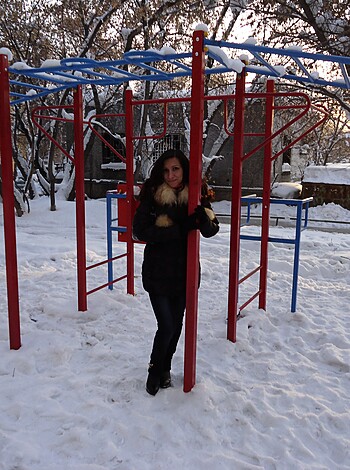 "This bitch is showing off her tits while playing on a fucking rainbow colored playground covered in snow."