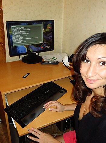 A fucking bitch with her ass parked on a chair typing away on her lap-top.