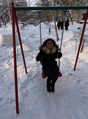 Some guy jerking off on a playset in the frozen tundra.