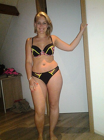 ```
This image is of a hot, curvy babe in a tight-ass black bikini that shows off her perfect tits and juicy ass. You better watch out, 'cause this chick's ready to fuck.
```