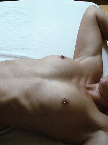 "Fuckin' chick, tits out, lying on her back on some bedsheets."
