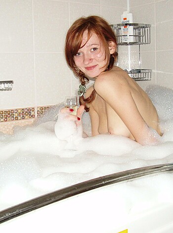 A naked chick in a tub full o' fuckin' bubbles, soapy-ass water.