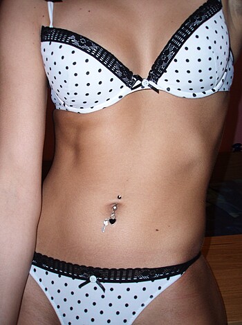 Vulgar description: "A chick in a tight-ass polka dot bra and panties, showing off her tits and snatch."