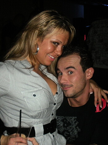 Here's some fuckin' dicks kissin' each other's faces with tongue out like they wantin' to get down with some oral sex shit but that's not gonna happen 'cause it looks like she's got a big ass diamond ring on her finger.