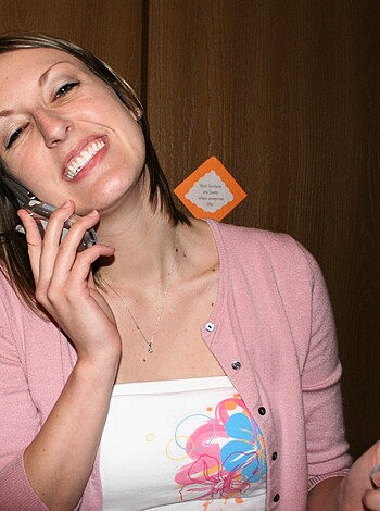 Image of a happy bitch on her goddamn cellphone.