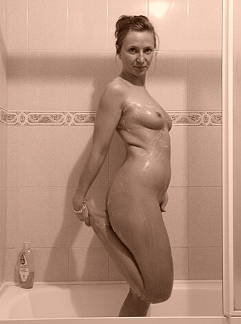 "Fucking hot bitch taking a steamy shower in her bathroom."