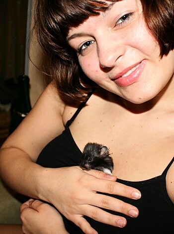 "This picture is of a bitch squeezing some fucking rodent with her cunt-like hands."