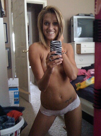 """
Busty blonde babe with bare ass cheeks flaunting her lacy panties.
""