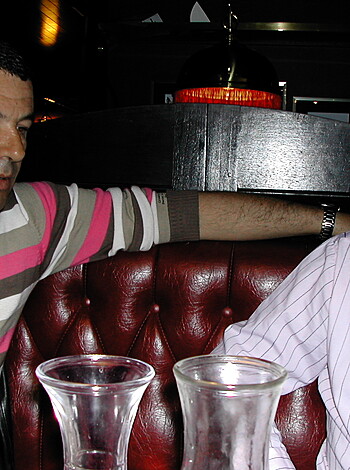 Fucking two dudes sit at the bar bullshitting with each other.