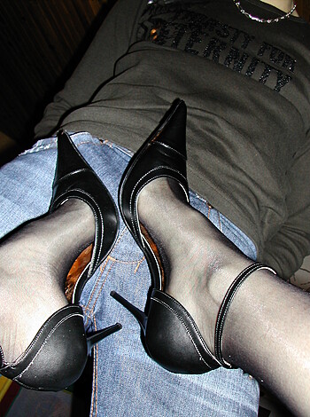 A pair of fucking sexy black thigh-highs with a pointy toe and a stiletto heel, goddamn it's hot!
