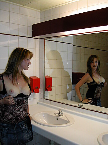 Here's a pic of some hot chick jackin off while lookin at her pussy in the mirror.