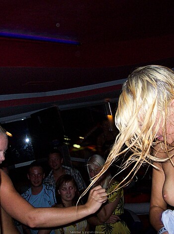 Look at this f***ing picture of some hot b**** who is completely shirtless with her tits hanging out at a goddamn party while she's having the time of her life and just laughing like a motherf***er. She's got her hair all messed up, swinging around like a f***ing idiot while she flashes everyone in sight.