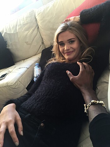 """
Dude's boobies get handled by a chick as they both grin and sit real tight.
"""