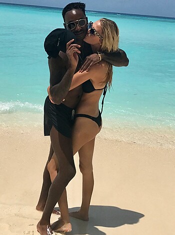 "Watch this fuckin' hot couple smacking lips on the sandy shore."