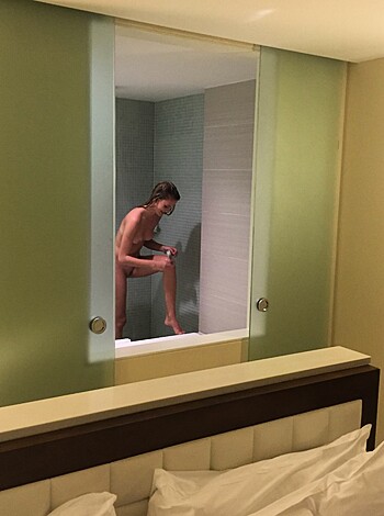 """
Here’s a picture of some bitch in a bathroom, with her ass out and her tits hanging. She looks like she just got railed and is trying to wash off the splooge.
"""