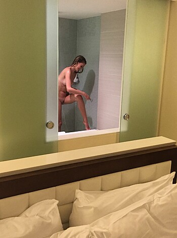 Vulgar description: "Nude chick in bathtub with her ass sticking out the window."