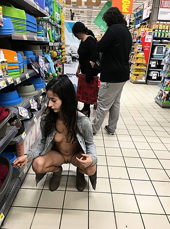 A naked bitch, bent over and grabbing stuff from the shelf.