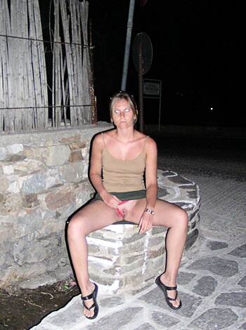 Vulgar Description: "Chick in a bikini ass sitting outside on some rocks at night, lookin' to her fucking left."