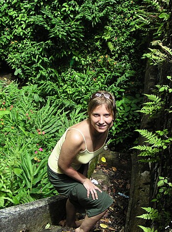 This broad is squatting outside in a fuckin' yellow dress with a stupid grin on her face like she doesn't even know that she's being photographed.