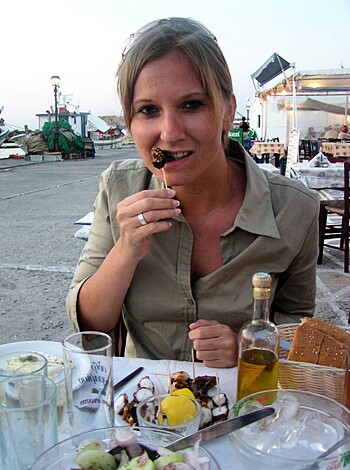 A naked bitch with a rack of tits is stuffing her face with a fucking chocolate cake, while her fingers are covered in gooey shit.