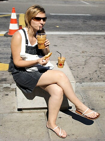 Vulgar description: 
Look at this fucking bitch drinking her goddamn coffee and devouring a delicious-ass donut outside like she owns the place. I mean, seriously? Fuck that shit!
