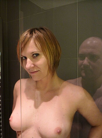 "Look at this hot ass naked couple fucking in the shower, their wet bodies reflecting off the glass like a goddamn mirage."