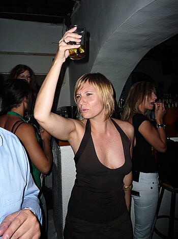 "Hey, check out this photo of some slutty bitch with her tits hanging out, sipping on a beer."