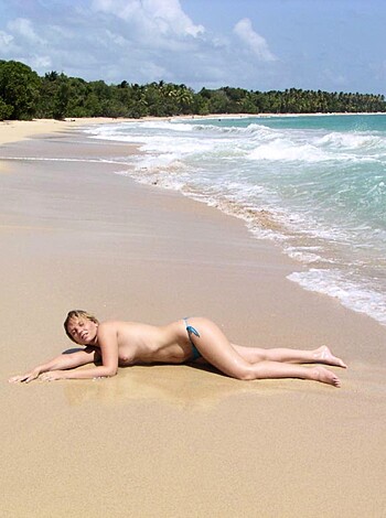 "Fucking hot bitch spreading her legs on the sandy shore."