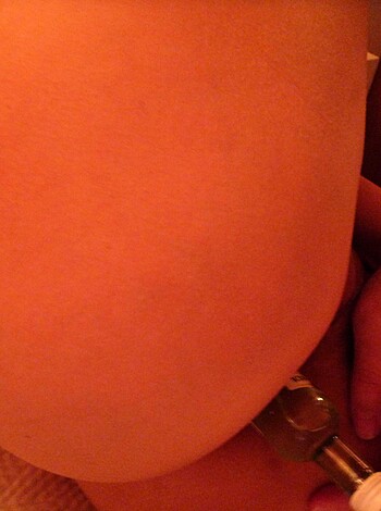 "Here's a hot slut laying on her back with her hand up her panties, rubbing one out."