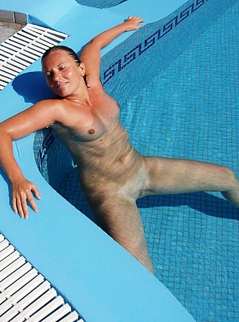 Here's the naked chick lying down on top of a fucking rubber dinghy in some goddamn pool while taking a dip.