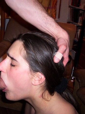 The lady is having her face hammered into the dick of some fella while another dude is getting a suckie on his knob with a gold ring, and he's shagging it into her gullet like a goddamn human cock-pump.