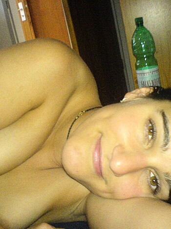 Vulgar description: "Here's a fucking hot chick with tits out, bitchin' on her bed, with a goddamn Coke bottle lying beside her."