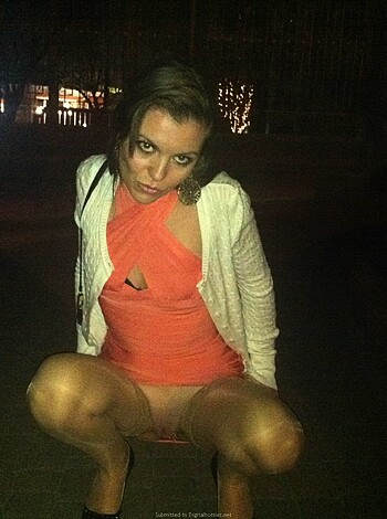 "Get ready to see some sweet thigh action, bitches! Check out this hotty in her red dress and stilettos, giving us a glimpse of her smooth thighs as she kneels down and looks up with those big doe eyes. Fucking hell, I'd tap that ass in a heartbeat."
