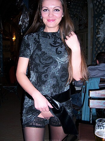 This bitch's outfit is see-through and showing off her titties for all the world to fucking gawk at!