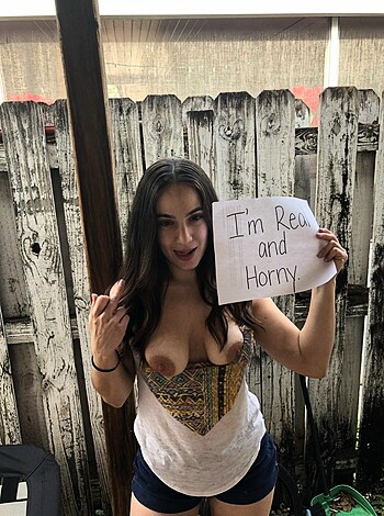 """
A titty-flashing, sign-holding honey badger who's ready for some lovin'.
"""
