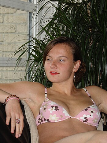 Fucking hot bitch chillin on some couch with no fucking top on.