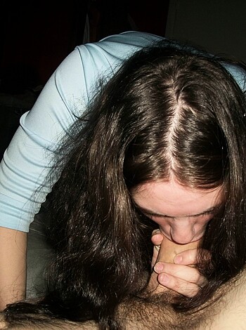 This image shows a bitch gagging on a dick.