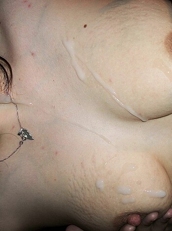 Here's the vulgar description of the image:
A woman's tits are dripping with white fluid, maybe it's fucking milk or goddamn cream.