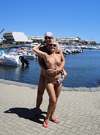 A horny couple fuckin' in front of boats on the dock, rubbin' their dicks together and makin' out like total freaks.